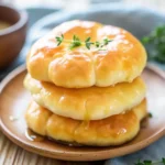 Warm, golden-brown cloud bread made with cottage cheese—light, airy, and fresh from the oven