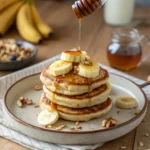 Banana cottage cheese pancakes with banana slices and honey