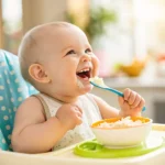 baby eating cottage cheese