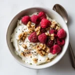 Low-carb cottage cheese breakfast bowl with raspberries, walnuts, and chia seeds
