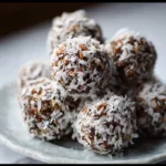 Delicious no-bake Chocolate Coconut Snowballs on a white plate