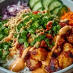 Delicious Bang Bang Chicken Bowl with spicy sauce and fresh ingredients