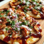 Easy BBQ chicken flatbread topped with fresh ingredients.