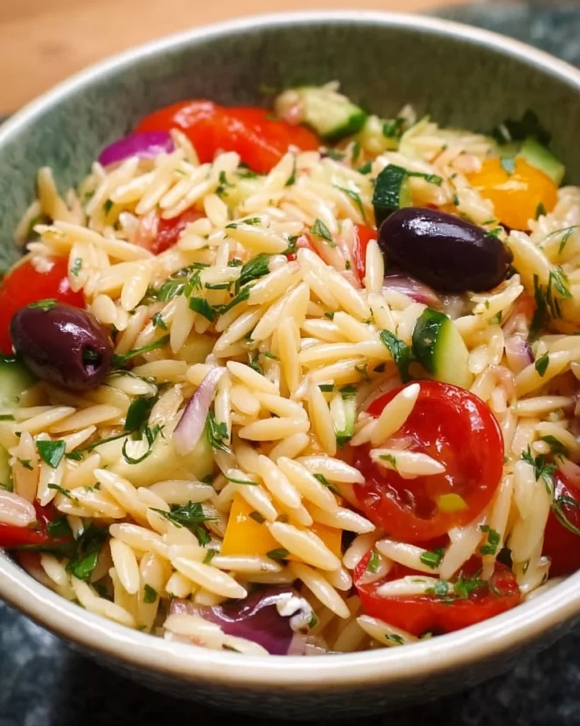 Juicy Mediterranean Orzo Pasta Salad with fresh vegetables and herbs